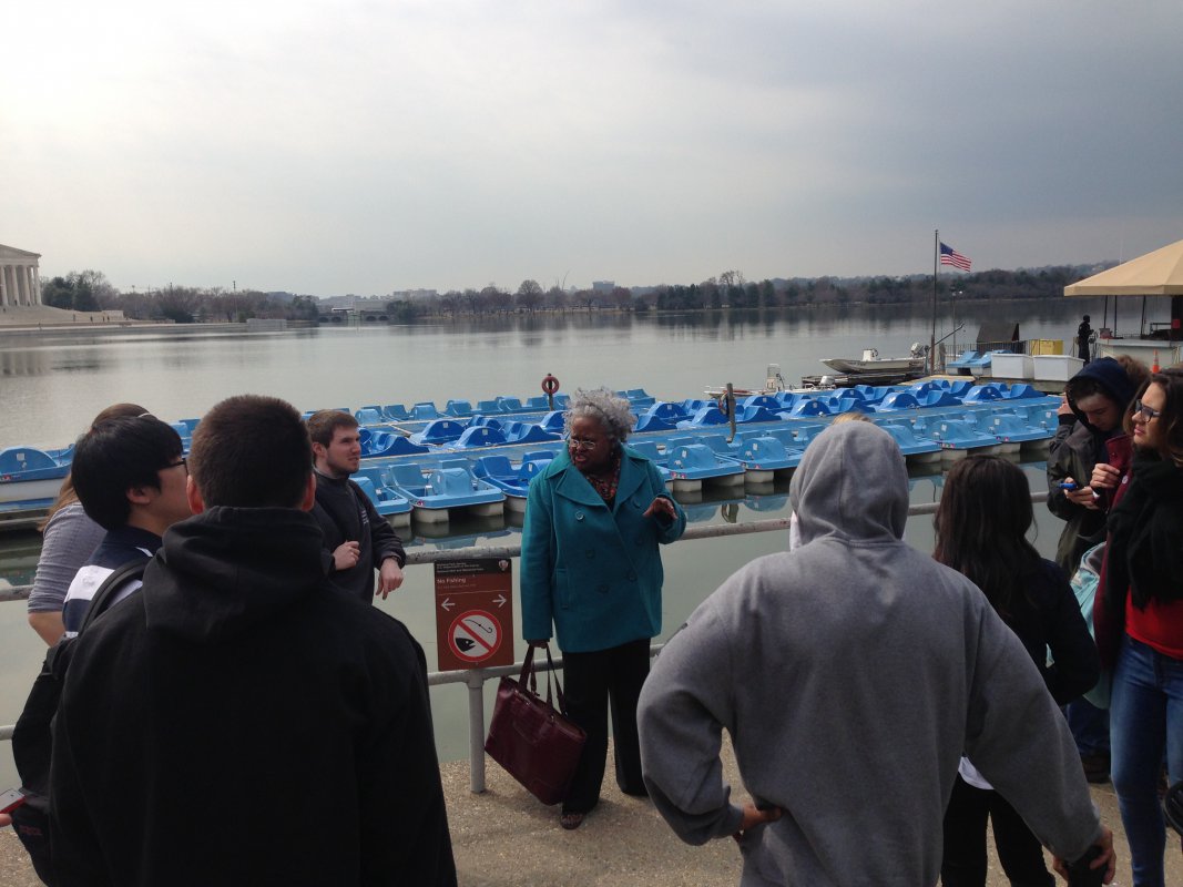 Dr. Daughtery shows her class the tidal basin and reviews the significance of the Cherry Blossom Festival in Washington, D.C.