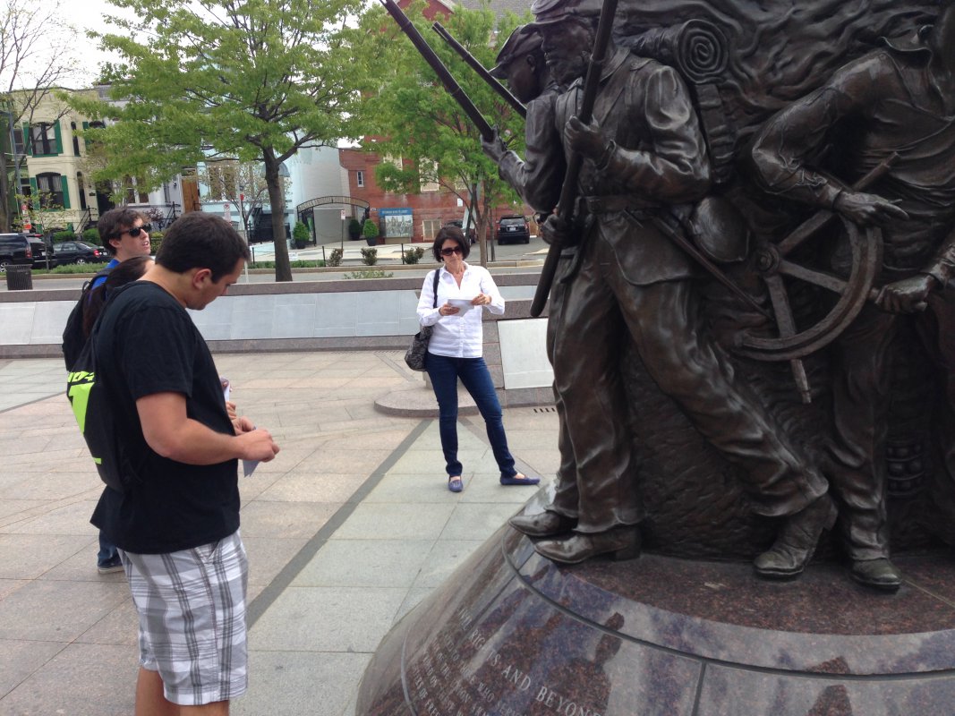 A CUA student observes the African American Civil War Museum located in the U Street area of Washington, D.C.