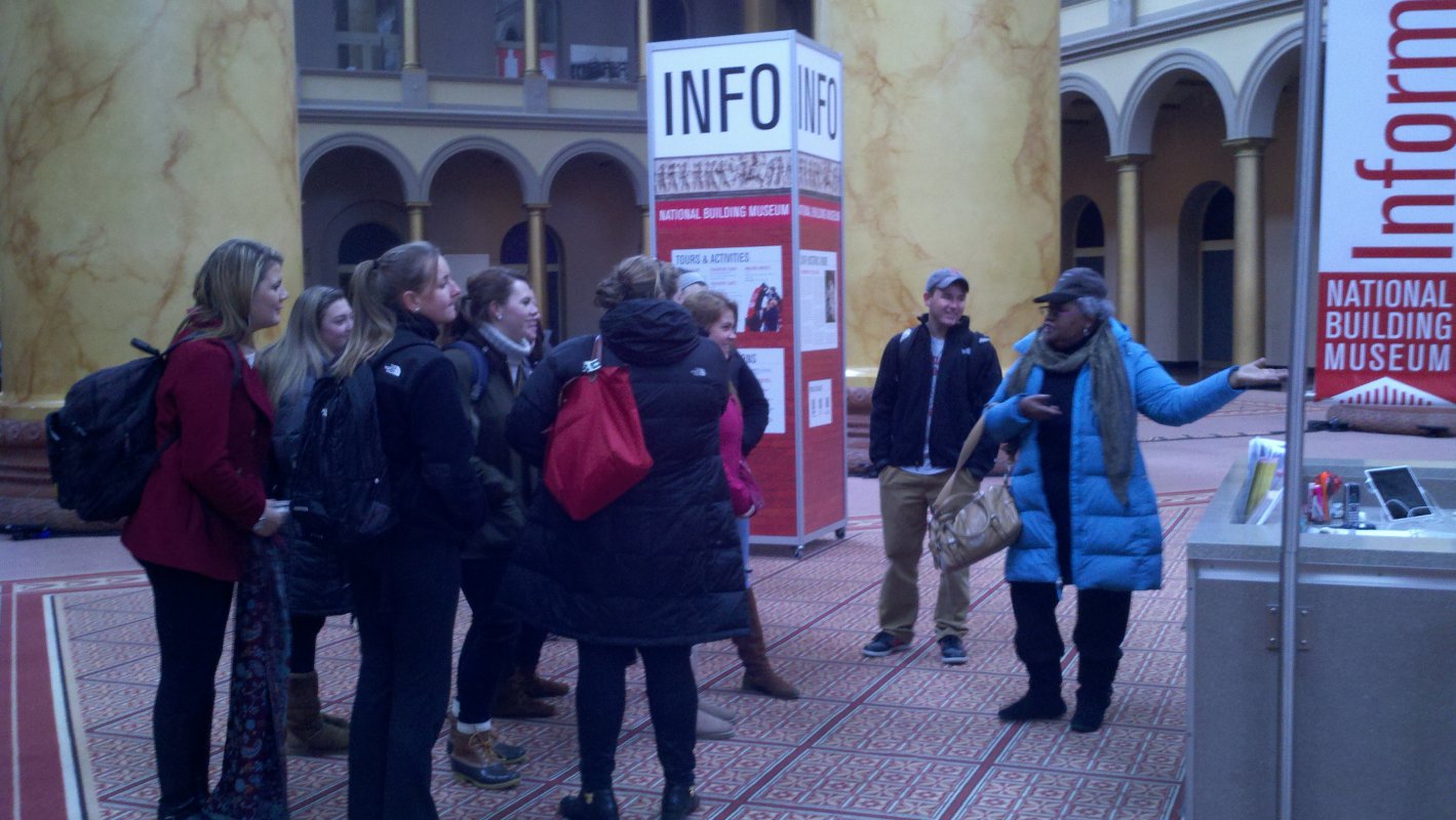 Dr. Daughtery teaching students about the history of the National Building Museum.