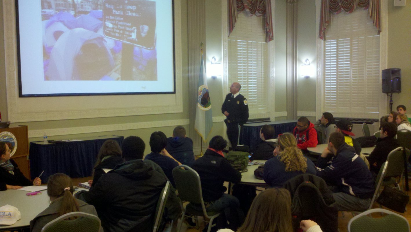 John Dillon of the United States Park Police gives a presentation to Catholic students at the Department of the Interior.