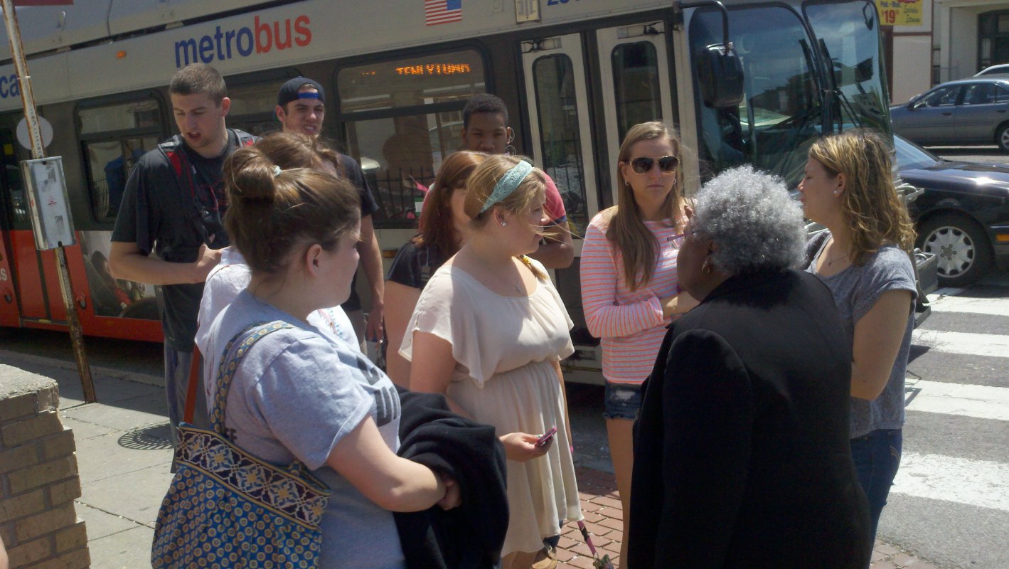 Dr. Daughtery and her students wait for the bus on their way back from Howard University.